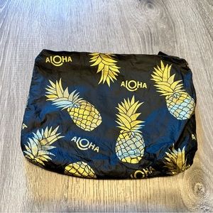 Small travel pouch, black with gold pineapples.  Aloha collection